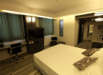 spacious deluxe room - hummingbird hotel